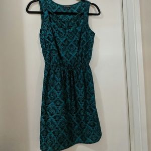 Green and black dress with geometric pattern